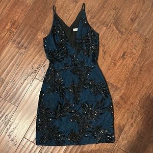 Cocktail dress. Navy with black beading. Cami straps, v neckline.